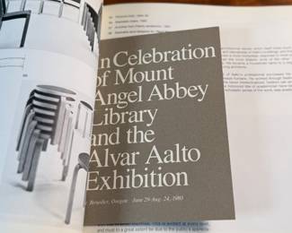 This lot features a rare book on the renowned, Alvar Aalto. Includes additional items in book, including Aalto’s exhibit pamphlet from the Mt. Angel Abbey show in 1980. Alvar Aalto (1898-1976) was a world-renowned Finnish architect, designer, and town planner, a key figure in Modernism, celebrated for his humanist approach blending functional design with organic forms and natural materials, leaving a legacy in buildings like Paimio Sanatorium and furniture like the Artek stools.

