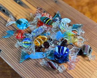 This lot features a large collection of Murano blown glass candy. Majority are in very good condition, some still with maker sticks as seen in photos.

