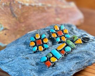 This lot features a stunning pair of Navajo earrings and a pendant made with sterling silver, turquoise, and spiny oyster shell jewelry. All items marked 925 with a total approx. weight of 26.82 grams. Signed by artist, "M".

