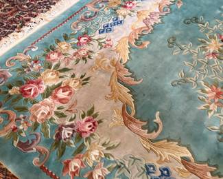 This lot features a hand-knotted Chinese Aubusson wool rug featuring a floral medallion design that measures, 144” H x 107” W.

