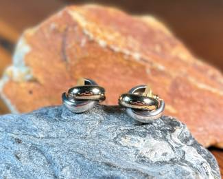 This lot features a pair of vintage 14k gold and sterling silver earrings with a total approx. weight of 7.00 grams.

