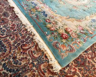 This lot features a hand-knotted Chinese Aubusson wool rug featuring a floral medallion design that measures, 144” H x 107” W.

