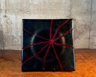 This lot features a stunning studio art glass tray. signed by the Aquila Art Glass Studio out of St. Helens, Oregon. This piece measures, 14” H x 14” W.

