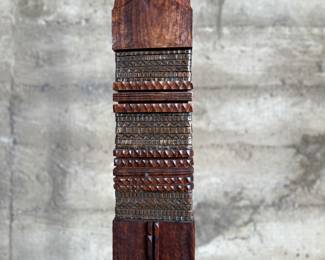 This lot features an incredible mahogany and copper sculpture by listed Oregon artist, Monica Setziol-Phillips. This piece sits in a custom iron base and measures, 75” H x 18” W x 13” D. Monica Setziol-Phillips has a B.A. degree in foreign languages from Portland State University. Monica who is married to Oregon Shakespeare Festival actor, Josiah Phillips, and daughter of well rememberd sculptor, Le Roy Setziol has been weaving for over 35 years and carving for over 20 years. Her work is in many private collections in many states. She also has work in puplic spaces, most recently three of her pieces were chosen for The Allison, the new resort in Newberg. In October of 2009 Monica finished a major work for the new Civic Hall in McMinnville, Oregon. For a number of years she has participated in the Sitka Art Invitational.

