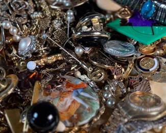 This lot features a large assortment of primarily antique jewelry, with items containing sterling silver, gold-fill, and much more.


