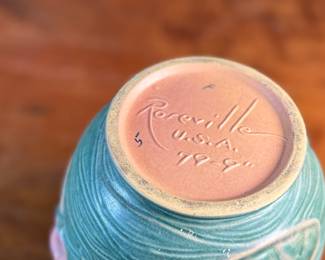 This lot features a pair of antique Roseville Pottery Vases. Two minor chips shown in photos and larger vase measures, 9.25” H x 8” W x 7” D.

