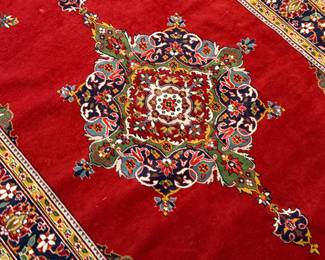 This lot features an antique handwoven Persian rug that measures, 74” H x 49” W.

