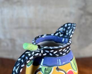 This lot features a studio made pitcher by listed Oregon artist, Mary Lou Zeek. Signed underneath and measures, 13” H x 9” W x 7” D.

