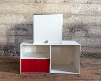This lot features a set of three (3) modular storage cubes from Finland company, Palaset. Designed by Ristomatti Ratia, the son of Marimekko’s founder, Armi Ratia. Fabricated from a hard, durable polystyrene, this versatile system is ideal for offices, playrooms, and mudrooms, yet easily stylish enough for the living room. Each cube measures, 13.5” H x 13.5” W x 13.5” D.

