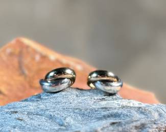 This lot features a pair of vintage 14k gold and sterling silver earrings with a total approx. weight of 7.00 grams.

