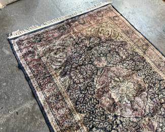 This lot features a handcrafted 100% satin pile Agra rug, made in India that measures, 75” H x 49” W.

