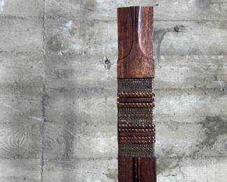 This lot features an incredible mahogany and copper sculpture by listed Oregon artist, Monica Setziol-Phillips. This piece sits in a custom iron base and measures, 75” H x 18” W x 13” D. Monica Setziol-Phillips has a B.A. degree in foreign languages from Portland State University. Monica who is married to Oregon Shakespeare Festival actor, Josiah Phillips, and daughter of well rememberd sculptor, Le Roy Setziol has been weaving for over 35 years and carving for over 20 years. Her work is in many private collections in many states. She also has work in puplic spaces, most recently three of her pieces were chosen for The Allison, the new resort in Newberg. In October of 2009 Monica finished a major work for the new Civic Hall in McMinnville, Oregon. For a number of years she has participated in the Sitka Art Invitational.

