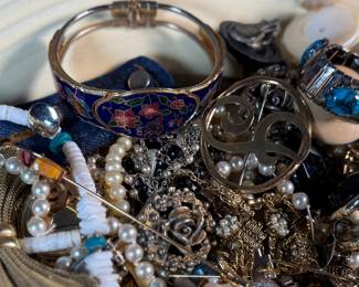 This lot features a large assortment of primarily antique jewelry, with items containing sterling silver, gold-fill, and much more.


