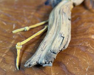 "Bad Spirit of the Mountain", an original carving by listed Alaskan artist, Adam John. Signed and titled on the verso circa 2002 and measures, 12” H x 5” W. Adam John is a noted Athabascan Native artist from Alaska, known for his traditional carvings, especially spirit masks and small sculptures, often depicting animals like owls or mountain spirits, and signed pieces can be found on art sites and auction platforms like eBay, continuing a heritage of Alaskan Native art. He’s associated with Central Alaska and his work is recognized for its cultural significance and craftsmanship. 

