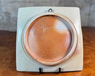This lot features a studio pottery charger by listed Oregon artist, Jeff Proctor. Signed on the verso and measures, 10” H x 10” W.

