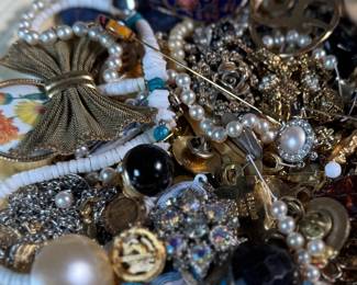 This lot features a large assortment of primarily antique jewelry, with items containing sterling silver, gold-fill, and much more.

