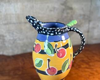 This lot features a studio made pitcher by listed Oregon artist, Mary Lou Zeek. Signed underneath and measures, 13” H x 9” W x 7” D.

