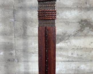 This lot features an incredible mahogany and copper sculpture by listed Oregon artist, Monica Setziol-Phillips. This piece sits in a custom iron base and measures, 75” H x 18” W x 13” D. Monica Setziol-Phillips has a B.A. degree in foreign languages from Portland State University. Monica who is married to Oregon Shakespeare Festival actor, Josiah Phillips, and daughter of well rememberd sculptor, Le Roy Setziol has been weaving for over 35 years and carving for over 20 years. Her work is in many private collections in many states. She also has work in puplic spaces, most recently three of her pieces were chosen for The Allison, the new resort in Newberg. In October of 2009 Monica finished a major work for the new Civic Hall in McMinnville, Oregon. For a number of years she has participated in the Sitka Art Invitational.

