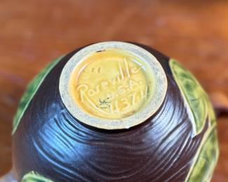 This lot features a pair of antique Roseville Pottery Vases. Two minor chips shown in photos and larger vase measures, 9.25” H x 8” W x 7” D.

