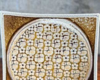 This lot features a studio pottery charger by listed Oregon artist, Jeff Proctor. Signed on the verso and measures, 10” H x 10” W.

