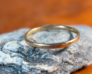 This lot features an antique baby bracelet, made of 5k gold and is engraved with the name, "Mary". Total approx. weight of 5.00 grams.

