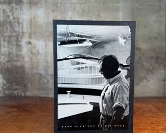 This lot features a collectible hardcover book with slipcase titled, Eero Saarinen on His Work, A Selection of Buildings. Edited by his wife, Aline Saarinen. Eero Saarinen (1910-1961) was a renowned Finnish-American architect and industrial designer, famous for his expressive, neo-futuristic structures and iconic furniture, including the Gateway Arch, TWA Flight Center, and Tulip Chairs; he was a leader in mid-century modernism, known for bold, organic forms and innovative materials, working closely with his architect father, Eliel Saarinen, before establishing his own influential firm.

