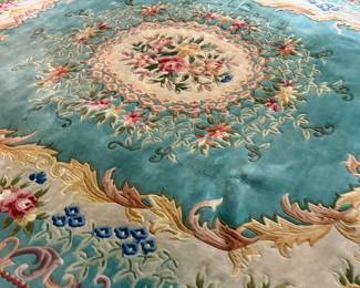 This lot features a hand-knotted Chinese Aubusson wool rug featuring a floral medallion design that measures, 144” H x 107” W.

