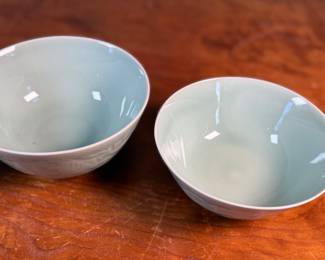 This lot features a set of three (3) celadon bowls. The two on each side are matching and the one in the middle a tad larger, measuring 3.25” H x 6.5” W x 6.5” D. The bowl on the right has a tiny chip on rim that is photographed, but not noticeable.

