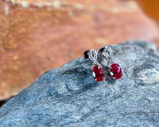 This lot features a pair of ruby and diamond ribbon stud earrings designed by, Sonia Hou. SONIA, a Los Angeles based Chinese American jewelry designer and fashion enthusiast, always had trouble finding stylish, reasonably priced jewelry that was safe on her skin and long-lasting in the sense that it will not easily flake. She would shop at major retailers and overspend on jewelry made out of cheap metals that would cause her allergic skin reactions.

