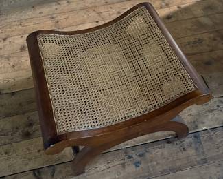 This lot features a British Colonial style plantation lounge chair with a matching ottoman in very good overall condition. The chair measures, 41” H x 24.5” W x 33” W.

