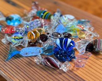 This lot features a large collection of Murano blown glass candy. Majority are in very good condition, some still with maker sticks as seen in photos.

