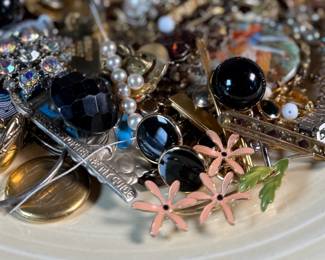 This lot features a large assortment of primarily antique jewelry, with items containing sterling silver, gold-fill, and much more.

