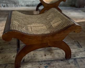 This lot features a British Colonial style plantation lounge chair with a matching ottoman in very good overall condition. The chair measures, 41” H x 24.5” W x 33” W.

