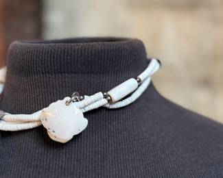 This lot features a special custom necklace by listed designer, Melanie DeLuca. Engraved sterling silver with shells & stones throughout. This piece measures, 17” and has a total approx. weight of 193.49 grams. Melanie DeLuca’s bold jewelry designs of mixed media, plastics and ethnographic objects embody a celebration of her 45 years as a metalsmith, jewelry designer and master teacher. Her interest in jewelry design began early and solidified at 17. By 20, she was apprenticing for master silversmith Brooks Darrow (himself an apprentice of renowned English architect and master metalsmith Louis Osman). Early work in painting and sculpture informed Melanie’s growing connection to the limitless expression of metal through jewelry design and fabrication.

