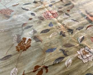 This lot features a rather unique hand-knotted wool rug that measures, 110” H x 72” W.

