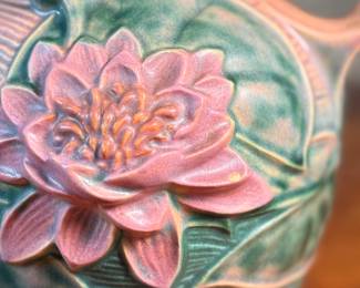 This lot features a pair of antique Roseville Pottery Vases. Two minor chips shown in photos and larger vase measures, 9.25” H x 8” W x 7” D.

