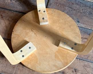 This lot features a set of three Artek Nesting Stools (model E60) in natural birch veneer, designed by Alvar Aalto. Each stool measures, 17” H x 13.5” W x 13.5” D. Designed by Alvar Aalto in 1933, the stools are a classic of Finnish modernism. They feature a patented L-shaped bent-leg construction, which makes them sturdy and easily stackable. 

