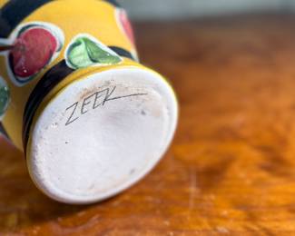 This lot features a studio made pitcher by listed Oregon artist, Mary Lou Zeek. Signed underneath and measures, 13” H x 9” W x 7” D.

