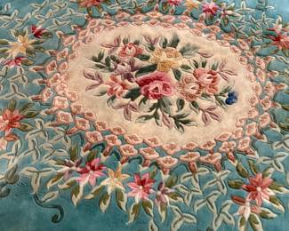 This lot features a hand-knotted Chinese Aubusson wool rug featuring a floral medallion design that measures, 144” H x 107” W.

