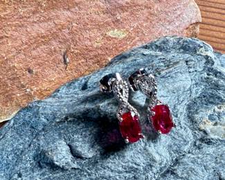 This lot features a pair of ruby and diamond ribbon stud earrings designed by, Sonia Hou. SONIA, a Los Angeles based Chinese American jewelry designer and fashion enthusiast, always had trouble finding stylish, reasonably priced jewelry that was safe on her skin and long-lasting in the sense that it will not easily flake. She would shop at major retailers and overspend on jewelry made out of cheap metals that would cause her allergic skin reactions.

