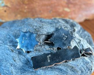 This lot features a stunning pair of Navajo earrings and a pendant made with sterling silver, turquoise, and spiny oyster shell jewelry. All items marked 925 with a total approx. weight of 26.82 grams. Signed by artist, "M".

