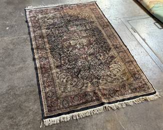 This lot features a handcrafted 100% satin pile Agra rug, made in India that measures, 75” H x 49” W.

