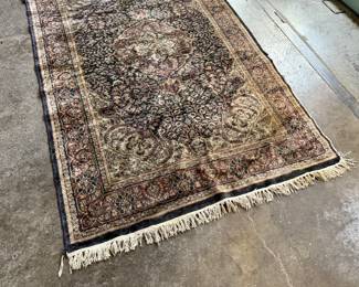 This lot features a handcrafted 100% satin pile Agra rug, made in India that measures, 75” H x 49” W.

