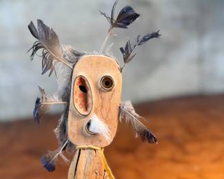 "Bad Spirit of the Mountain", an original carving by listed Alaskan artist, Adam John. Signed and titled on the verso circa 2002 and measures, 12” H x 5” W. Adam John is a noted Athabascan Native artist from Alaska, known for his traditional carvings, especially spirit masks and small sculptures, often depicting animals like owls or mountain spirits, and signed pieces can be found on art sites and auction platforms like eBay, continuing a heritage of Alaskan Native art. He’s associated with Central Alaska and his work is recognized for its cultural significance and craftsmanship. 

