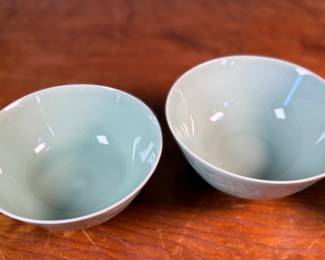 This lot features a set of three (3) celadon bowls. The two on each side are matching and the one in the middle a tad larger, measuring 3.25” H x 6.5” W x 6.5” D. The bowl on the right has a tiny chip on rim that is photographed, but not noticeable.

