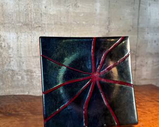 This lot features a stunning studio art glass tray. signed by the Aquila Art Glass Studio out of St. Helens, Oregon. This piece measures, 14” H x 14” W.

