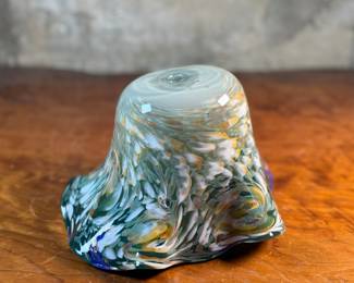 This lot features a stunning art glass vase by listed artist, Mark Russell. Signed underneath as shown in photos and measures, 7” H x 11” W x 11” D.

