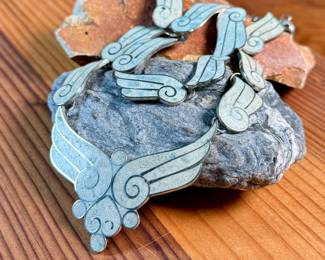 This lot features a gorgeous set of Taxco jewelry with sterling silver and inlaid blue stone with a marble-like appearance. The necklace measures, 17” and the bracelet, 7”. All items bear a maker’s mark as shown in photos with a total approx. weight of 58.00 grams.

