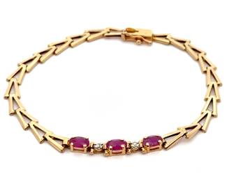 Ruby Three-Stone Fancy Link Bracelet in Yellow Gold