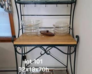 Iron baker's rack with butcher block style work top and glass shelves